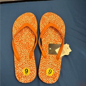 Orange and white Hurley flip flops Size 9 NWT.